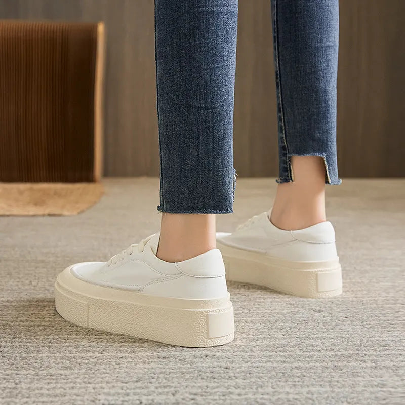 Women's black platform casual sports shoes with embossed cowhide upper and tied lace design