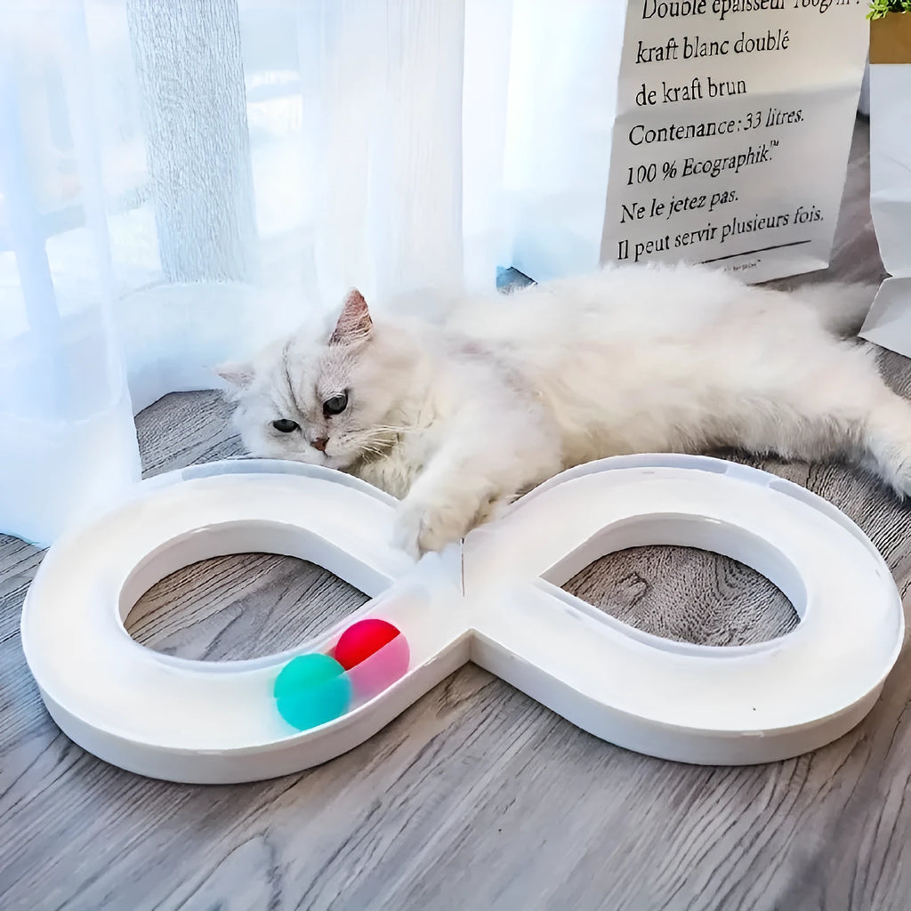 Blue and white cat turntable toy set with track balls and a feather teaser stick on a plain background.