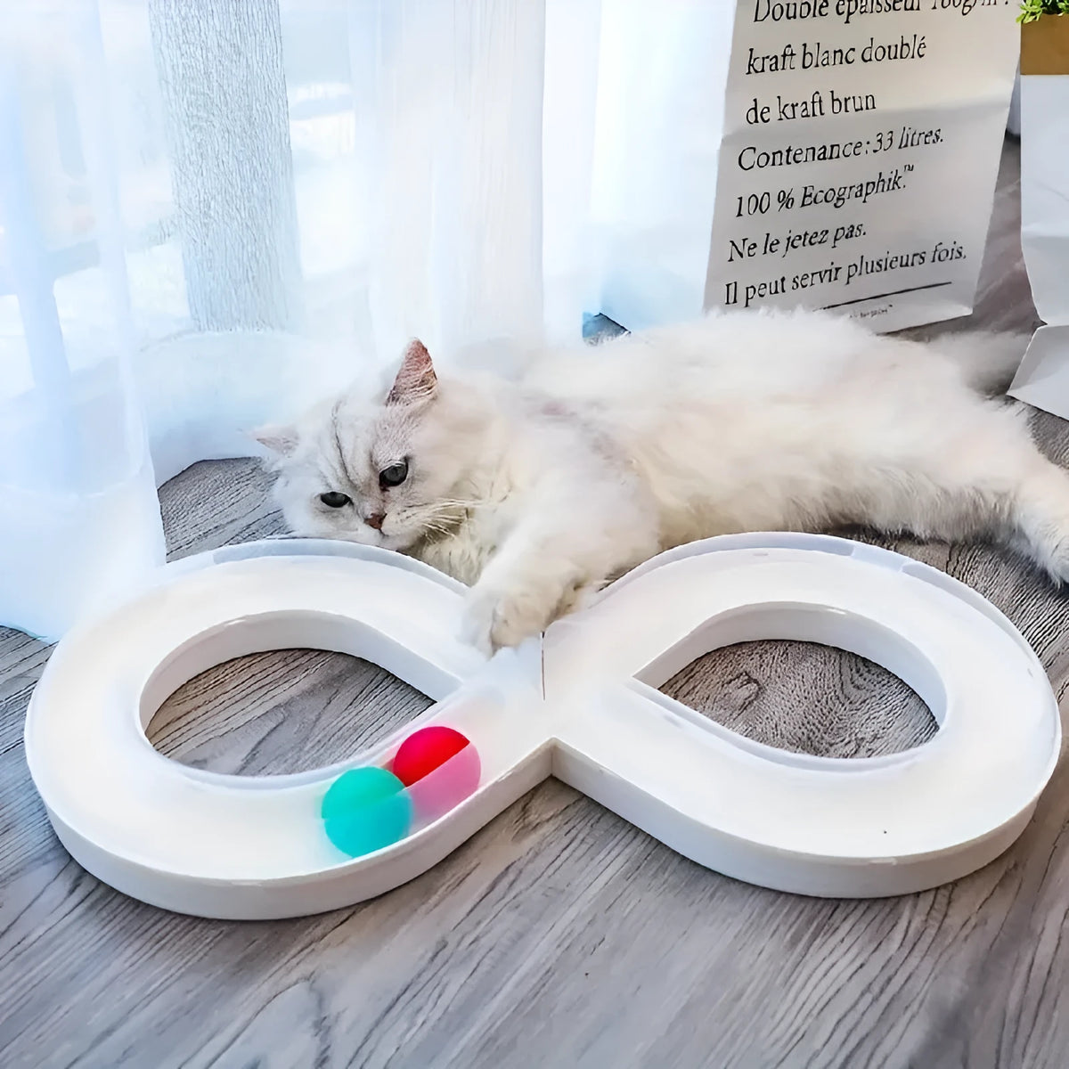 Blue and white cat turntable toy set with track balls and a feather teaser stick on a plain background.