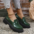 Plus size women's black slip-on loafers with a chunky platform heel and rubber sole