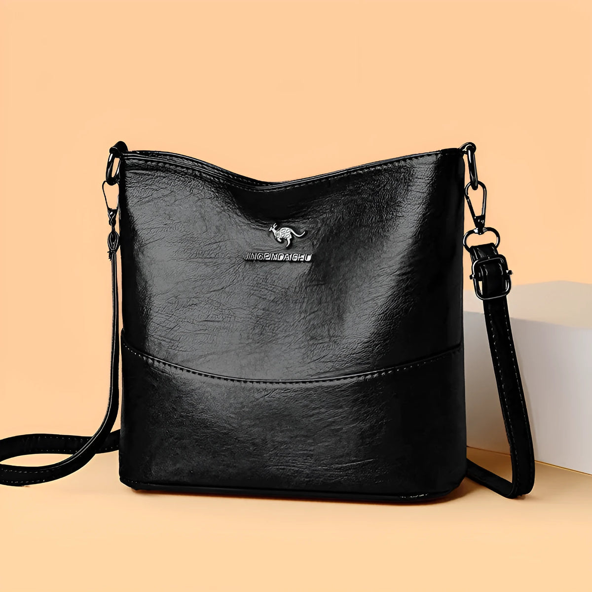 Women's leather bucket shoulder bag in solid colour with phone pocket and sandwich pockets