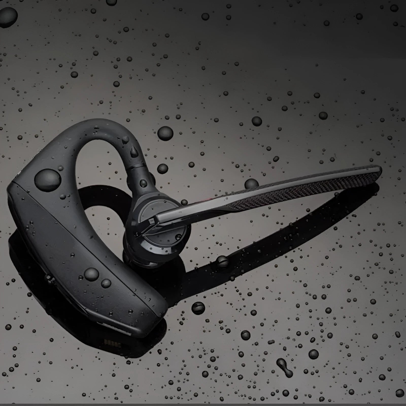 Black Bluetooth sports headphones with USB charging port showing battery display