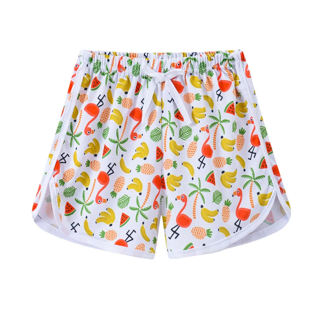 Children's colourful polyester beach shorts showing patterns like leopard print, stripes, and pineapples.