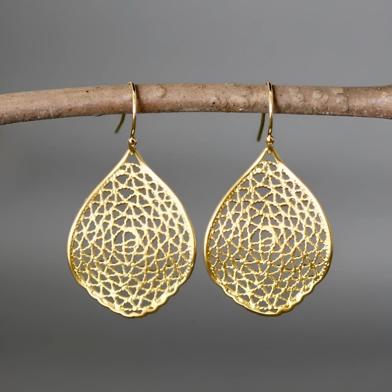 Gold retro leaf hollow drop earrings with vintage style dangling design