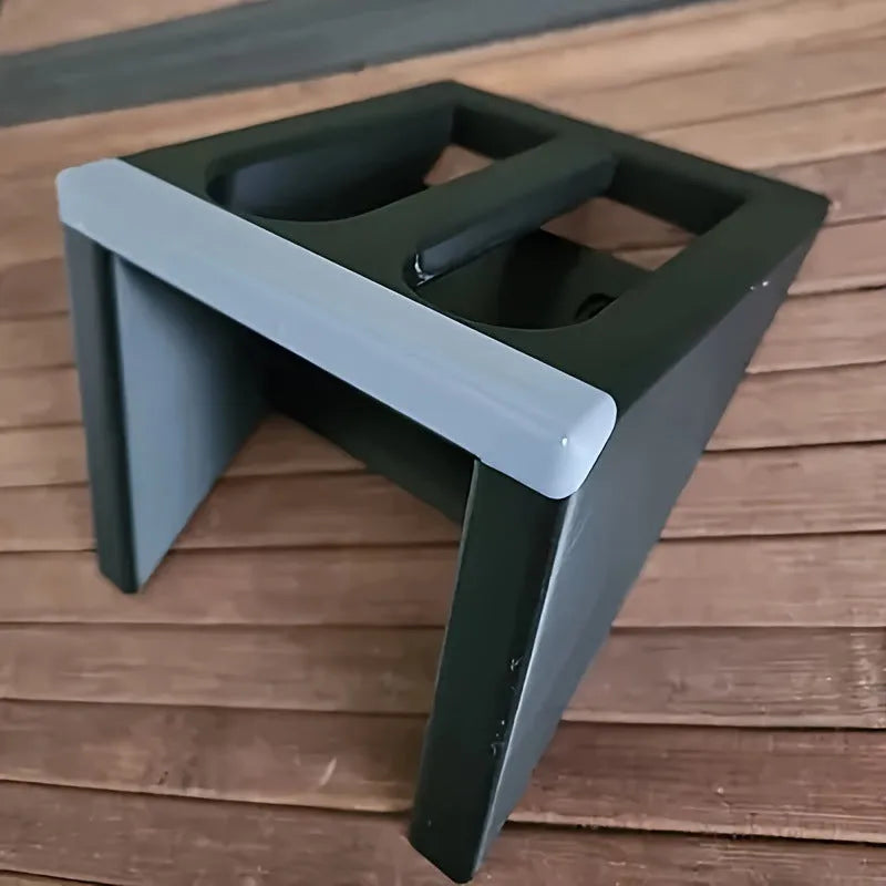 Black punk-style plastic pistol stand for replica firearms measuring 10.85cm tall