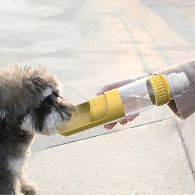 Dark blue portable dog water bottle with integrated drinking bowl showing leak-proof lock mechanism
