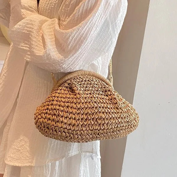 Women's woven paper straw beach bag with shoulder chain in khaki colour showing interior zip pocket