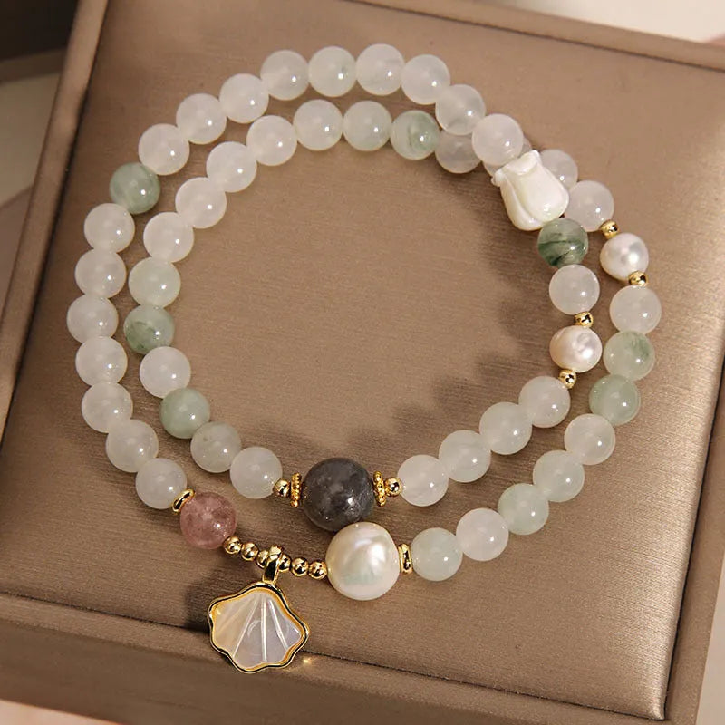 Gold-plated crystal bracelet for women with a Tianshan jade green ginkgo leaf pendant and rhinestones.
