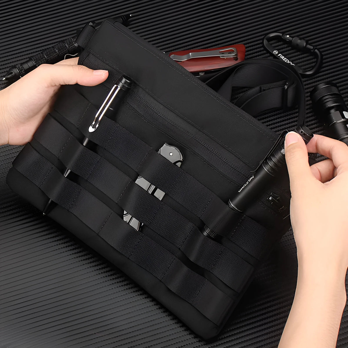 Black Oxford cloth portable outdoor organiser kit measuring 18cm by 3.5cm