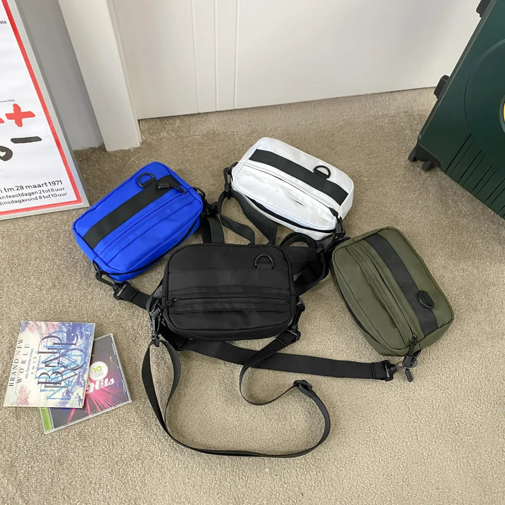 Men's street style messenger bag in solid colour with crossbody strap and nylon construction