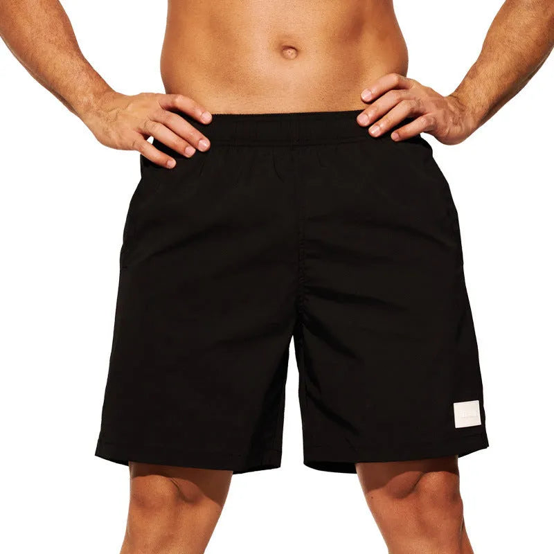 Men's solid colour quick-dry nylon sports casual shorts in straight leg fit.
