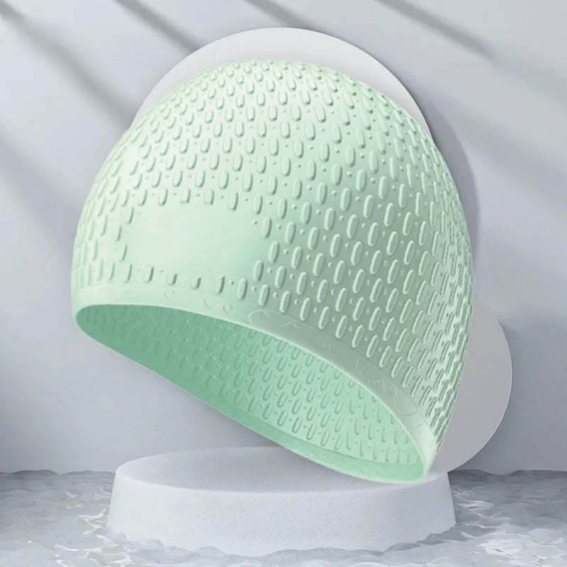 Silicone water drop style swimming cap for adults in various solid colours