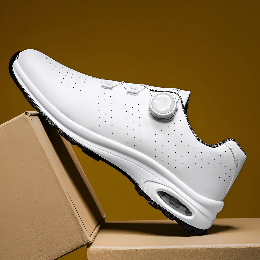 Low top mesh tennis shoes with cross straps and composite sole in black and white