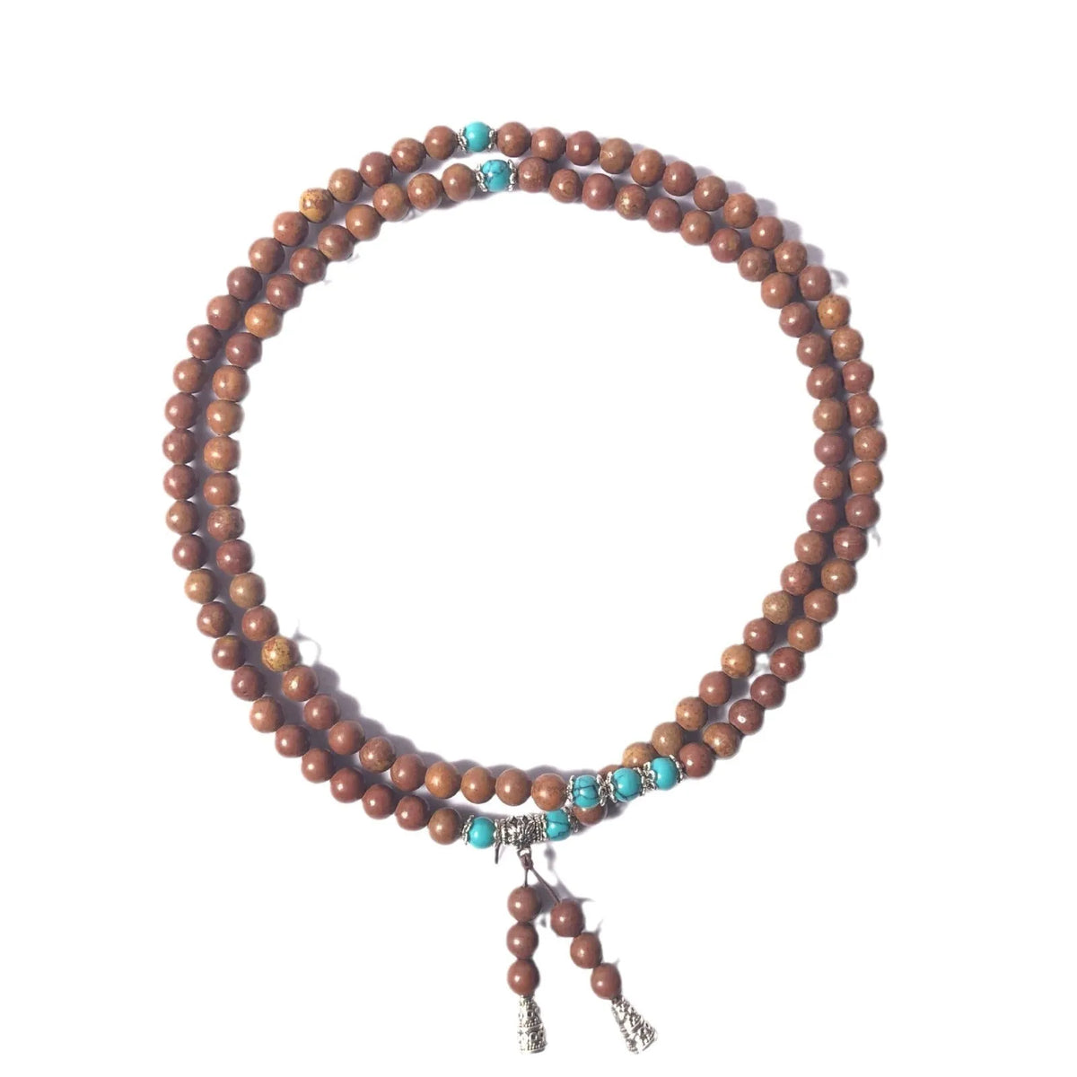 Handmade stone bead bracelet with 108 round geometric beads on a wrist.