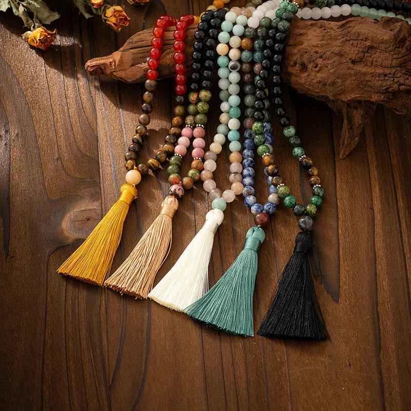 Vintage style long beaded necklace with geometric stone beads and matching bracelet in antique-inspired colours