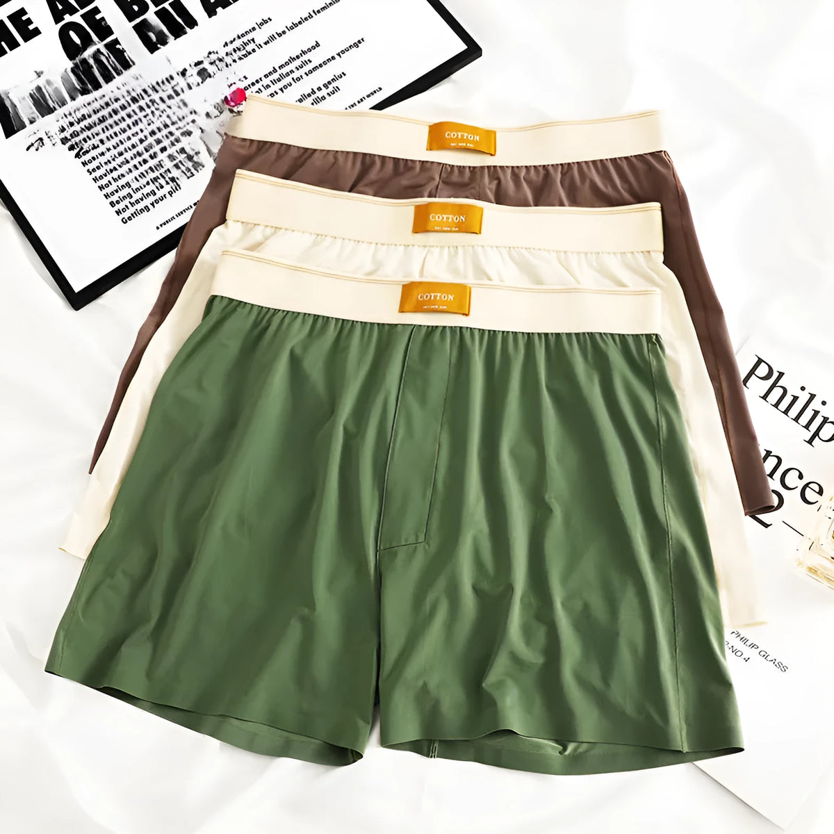 Pack of three men's loose fit solid colour underwear in ice silk fabric.