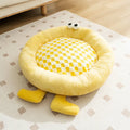Elf Briquettes blue plush pet bed mat inside a dog crate
