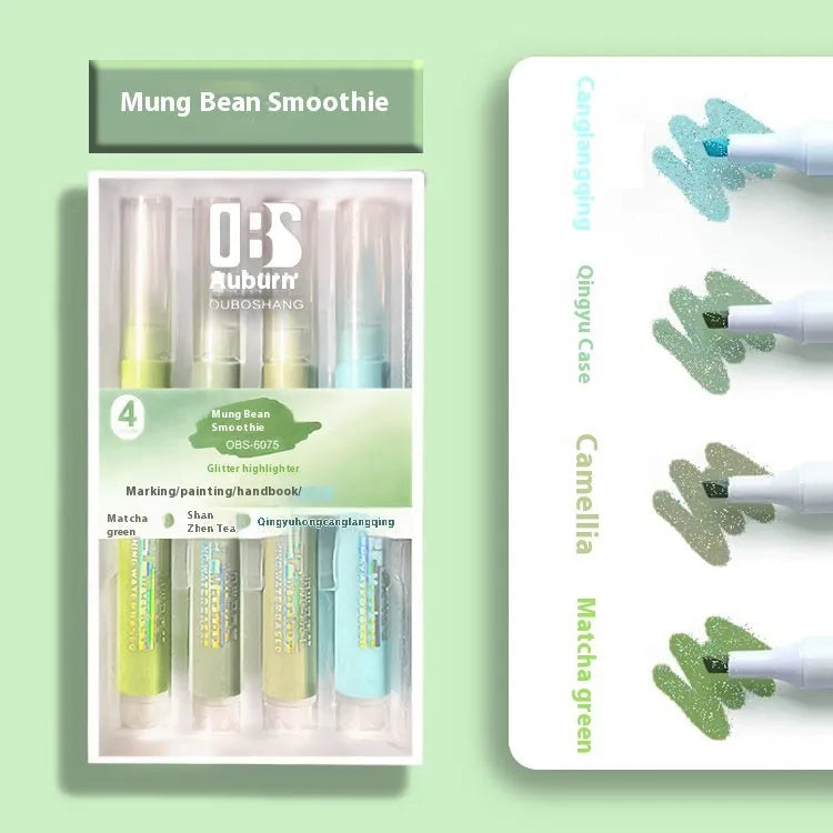 Four glitter fluorescent highlighter pens with slanted tips shown in a set.