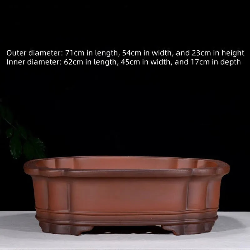 Large antique-finish Chinese purple clay flower pot with decorative tree stump and floral motifs.