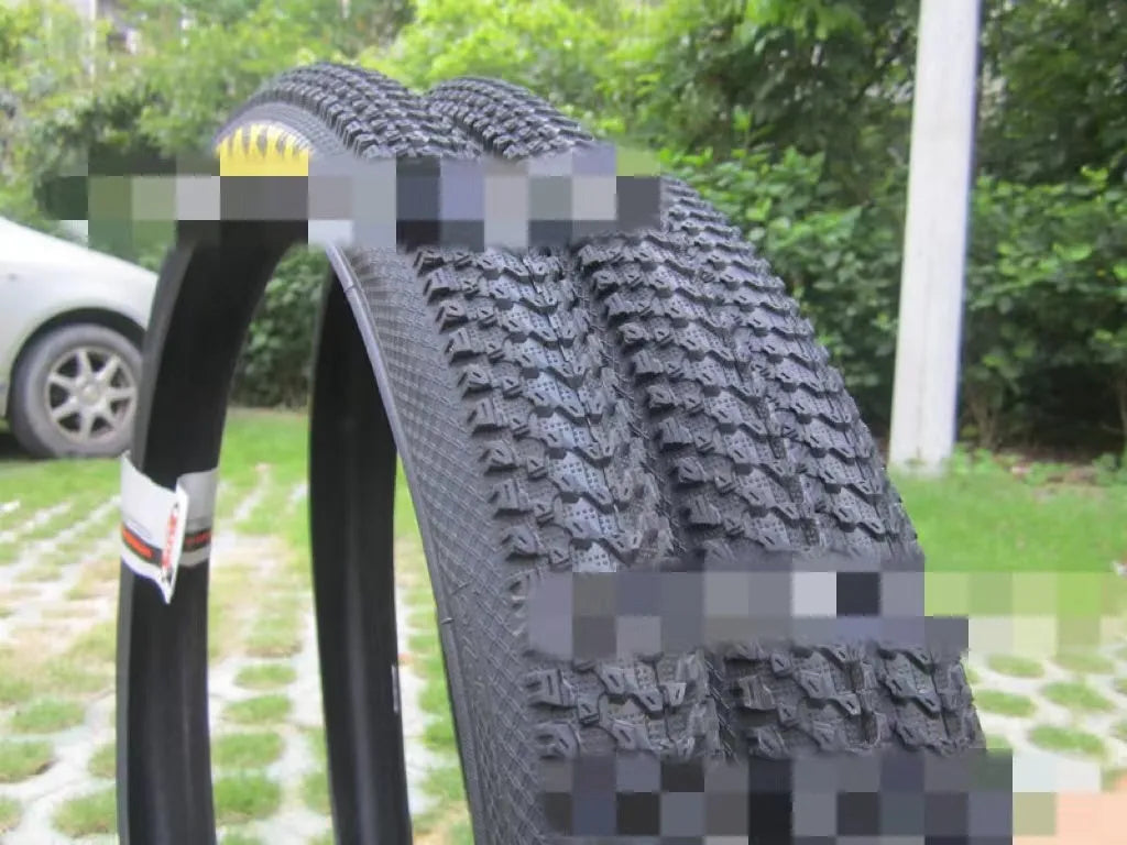 Mountain bike ultralight puncture proof tyre showing tread and white label sidewall option.