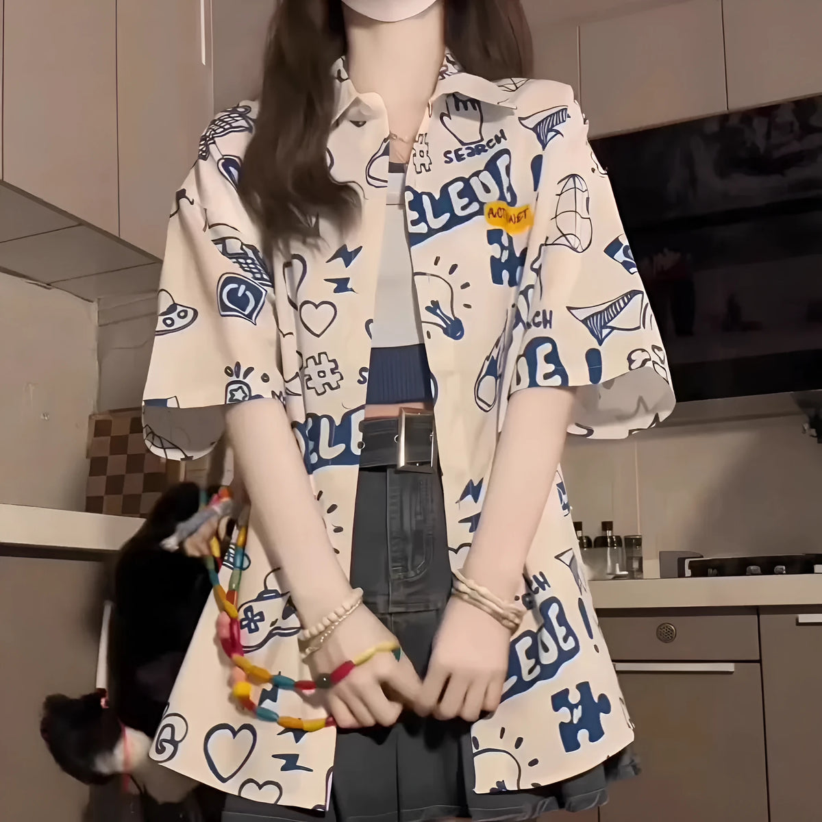 Student loose fit casual shirt with cartoon animation video game graffiti print in white or dark blue, sizes S to 2XL.