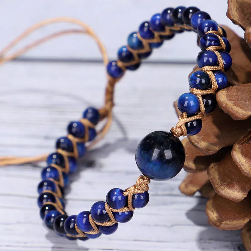 Handwoven geometric pull bracelet with blue tiger eye stone beads.