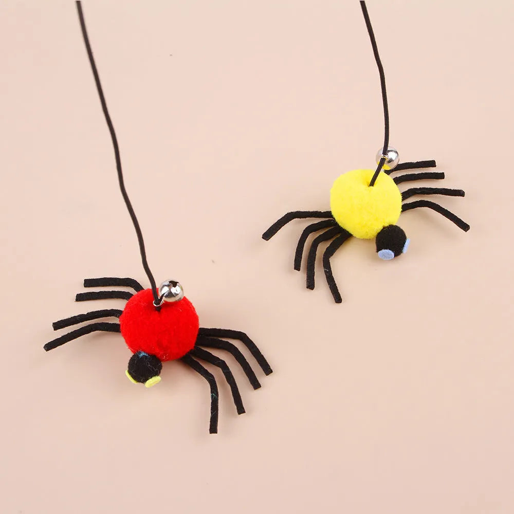Red and yellow hanging door cat toy with elastic rope, feather, bell, and spider attachments