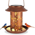 Iron art solar lamp bird feeder with hummingbird pattern for garden decoration.