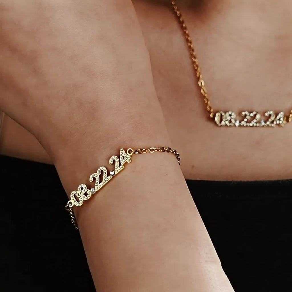 Stainless steel digital bracelet or necklace with diamond studs and clear number display.