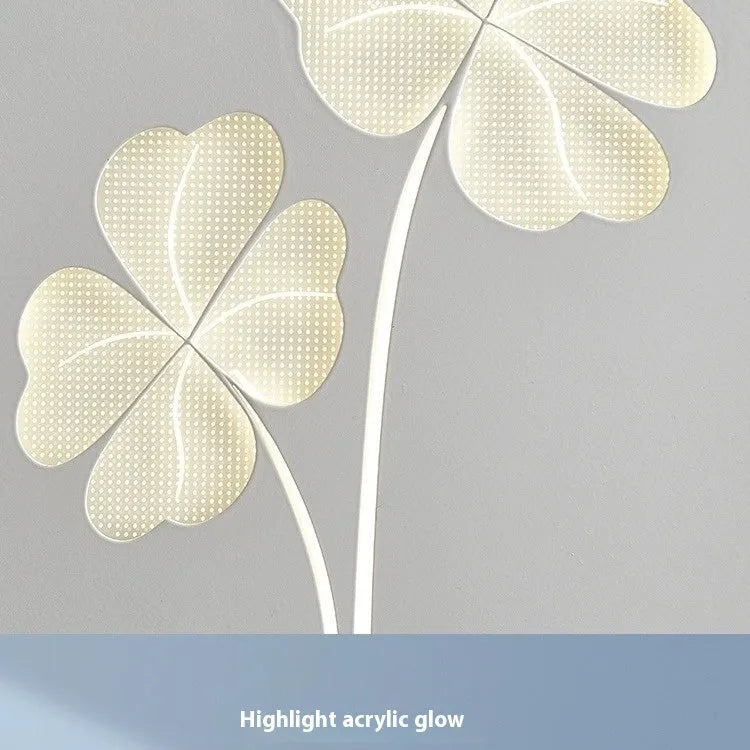 Modern cream bedside wall lamp with tricolour LED light and acrylic shade in love heart design