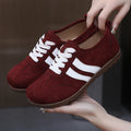 Women's vintage canvas sneakers in dark red with round toe and flat rubber sole