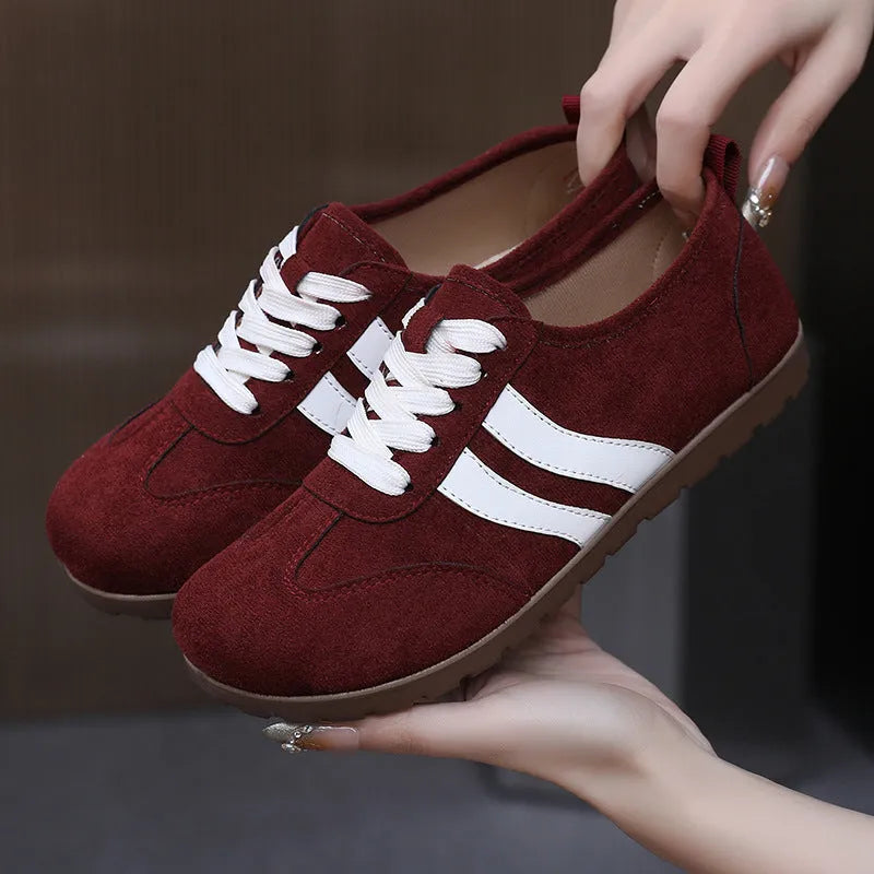 Women's vintage canvas sneakers in dark red with round toe and flat rubber sole