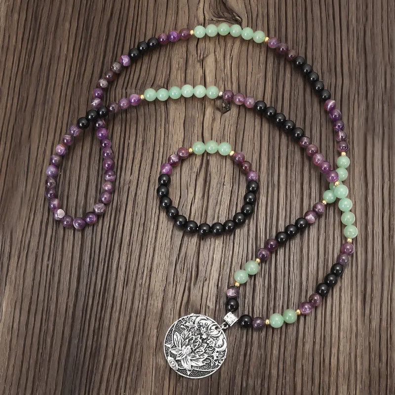 Dongling Long handmade stone bead necklace with alloy lotus pendant and matching bracelet.