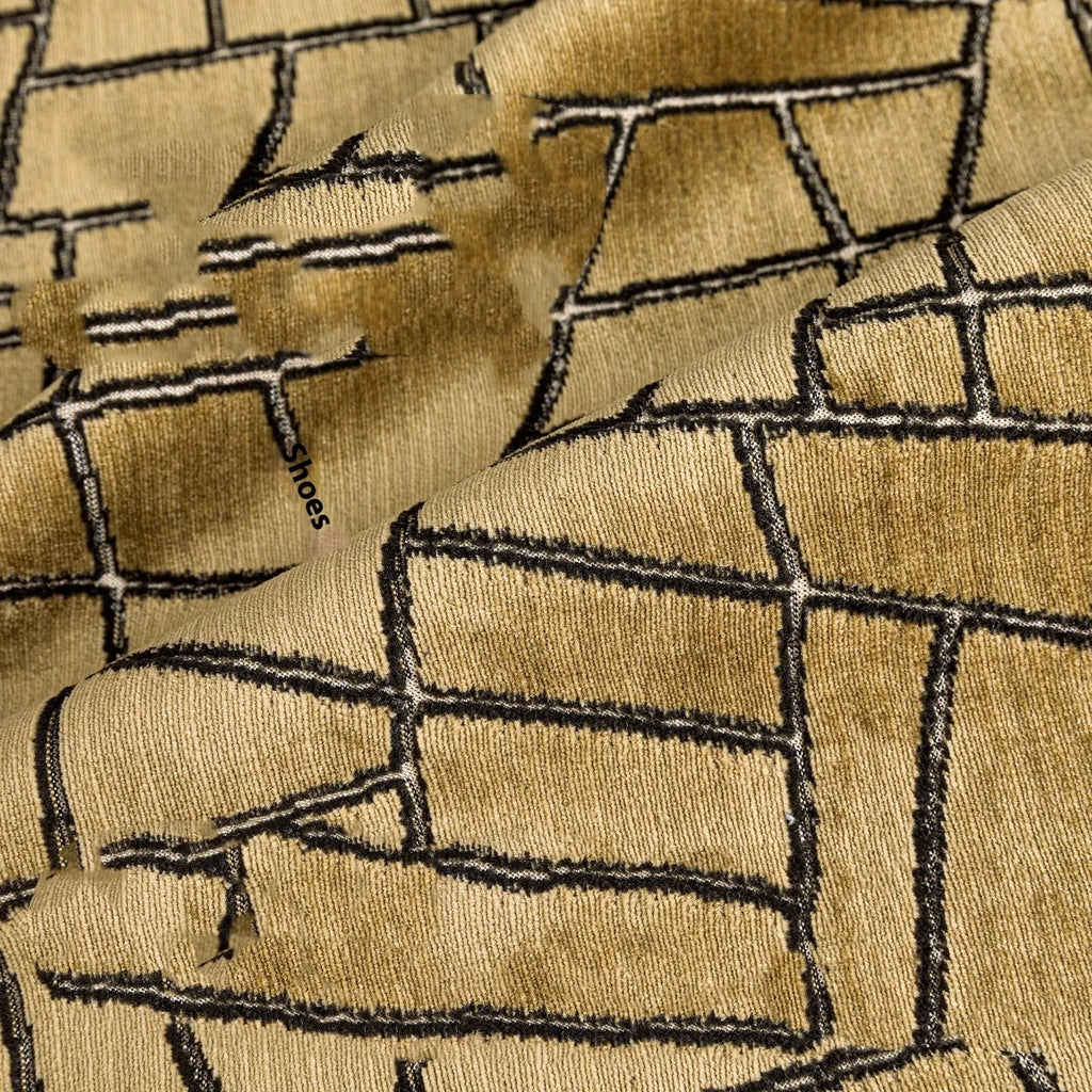 Tuhao gold geometric abstract pattern on a velvet square cushion cover and lumbar pillow.