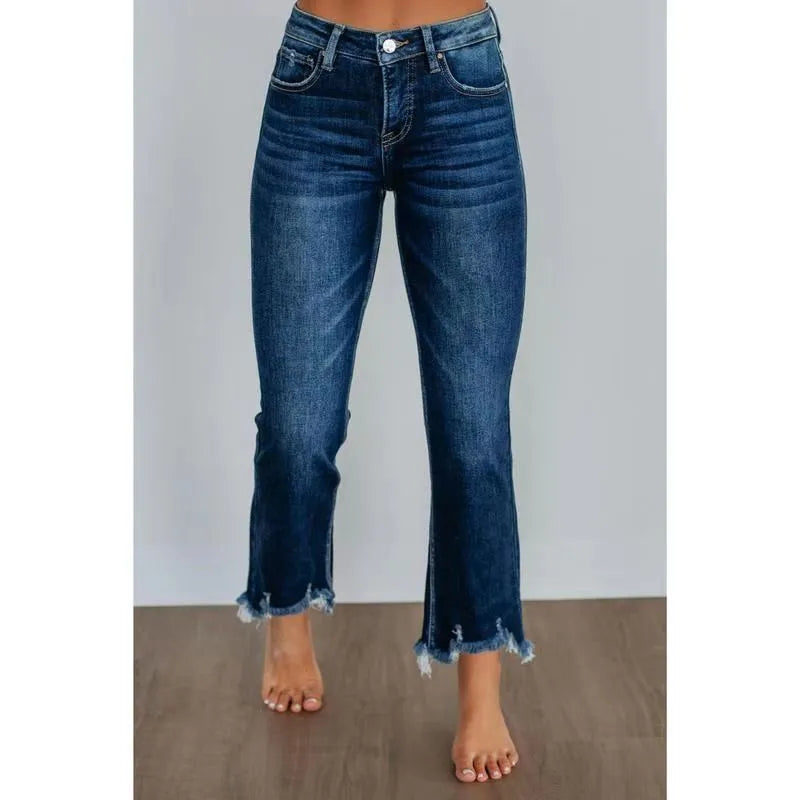 Women's solid colour denim jeans with hand-worn distressing in light blue wash, straight leg fit