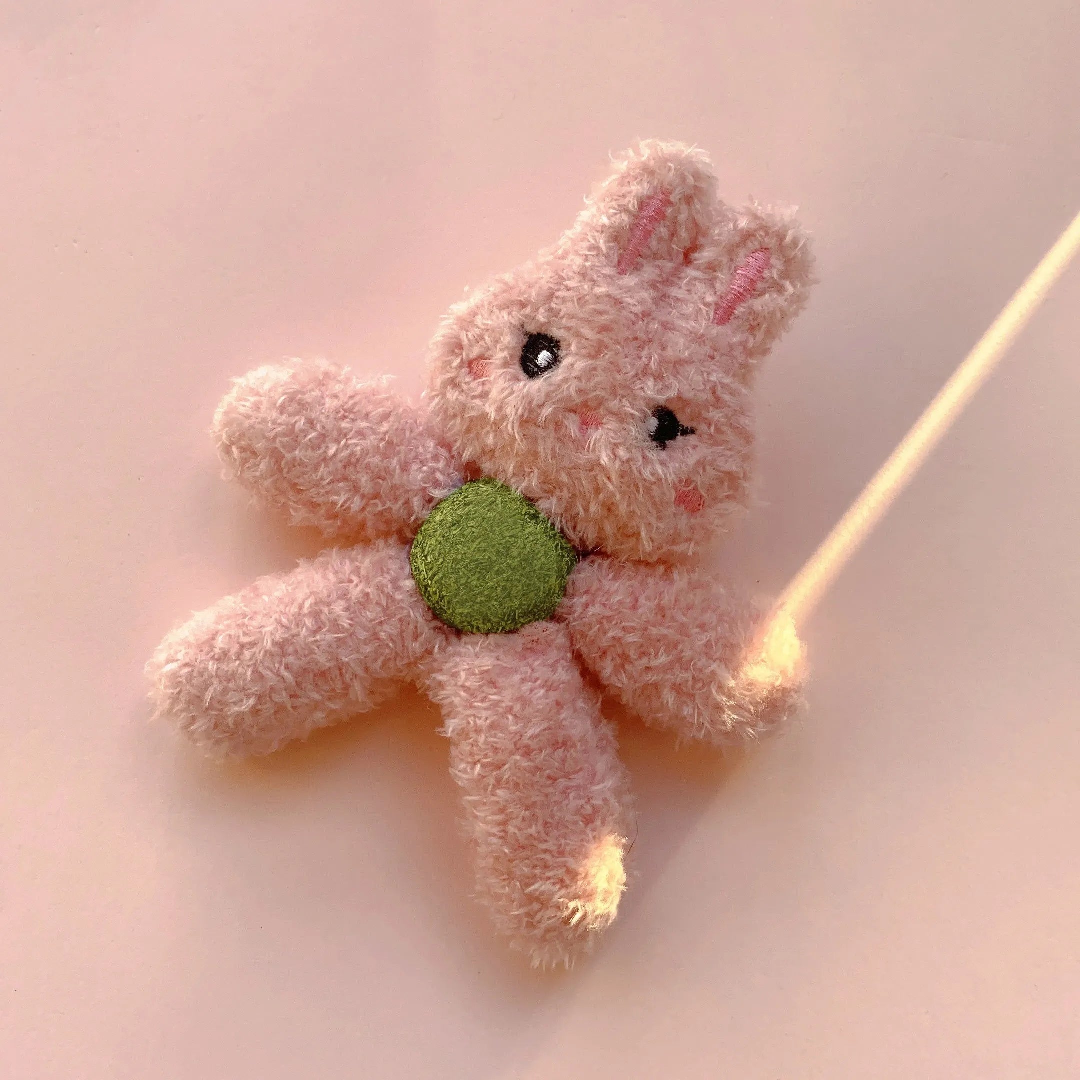 Plush catnip ball chewing toy in animal designs for dental care, showing scale next to a 12.5 cm ruler.
