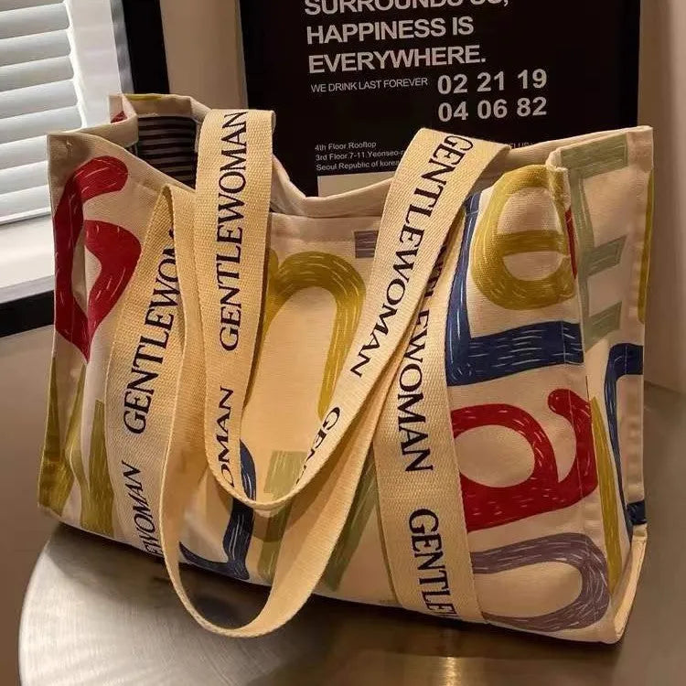 Canvas tote bag with printed design, large capacity for shopping and travel