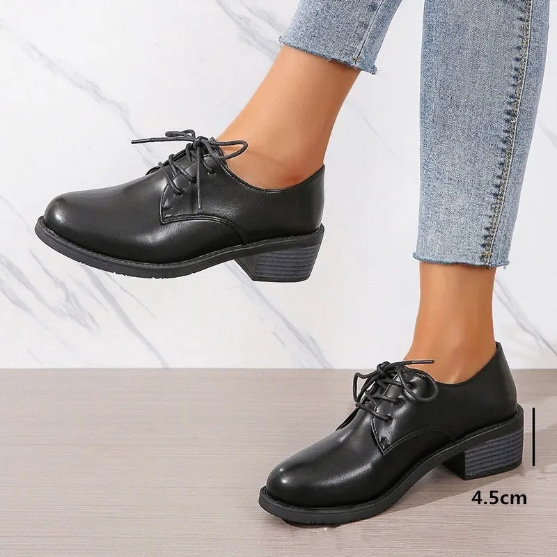 Black women's professional work shoes with chunky heel and pointed toe design