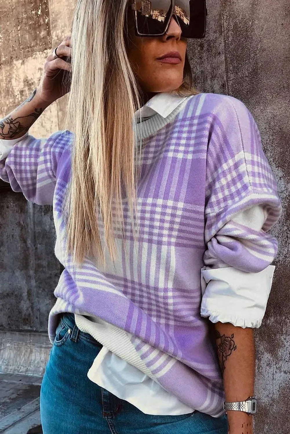 Lilac plaid print loose sweater with ribbed trim and long sleeves on hanger