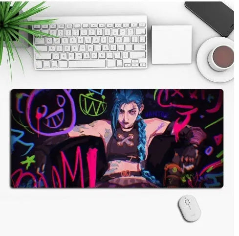 Anime design gaming mouse pad with non-slip rubber base shown on a desk