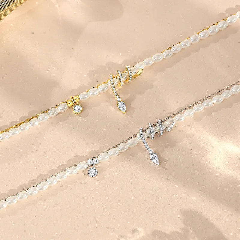 Pearl Snake 925 silver bracelet with snake charm, available in gold or white gold electroplated finish.