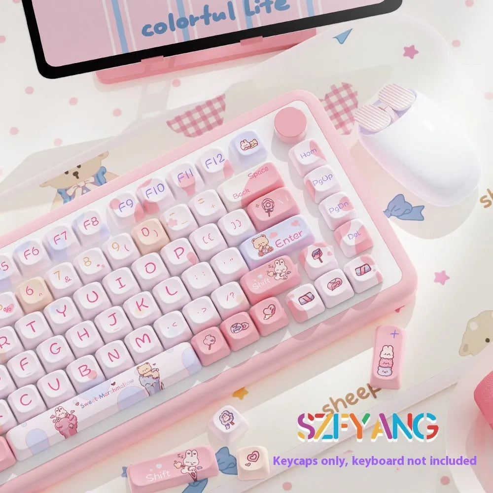 Sweet cotton candy coloured PBT pudding keycaps for mechanical keyboards on a desk