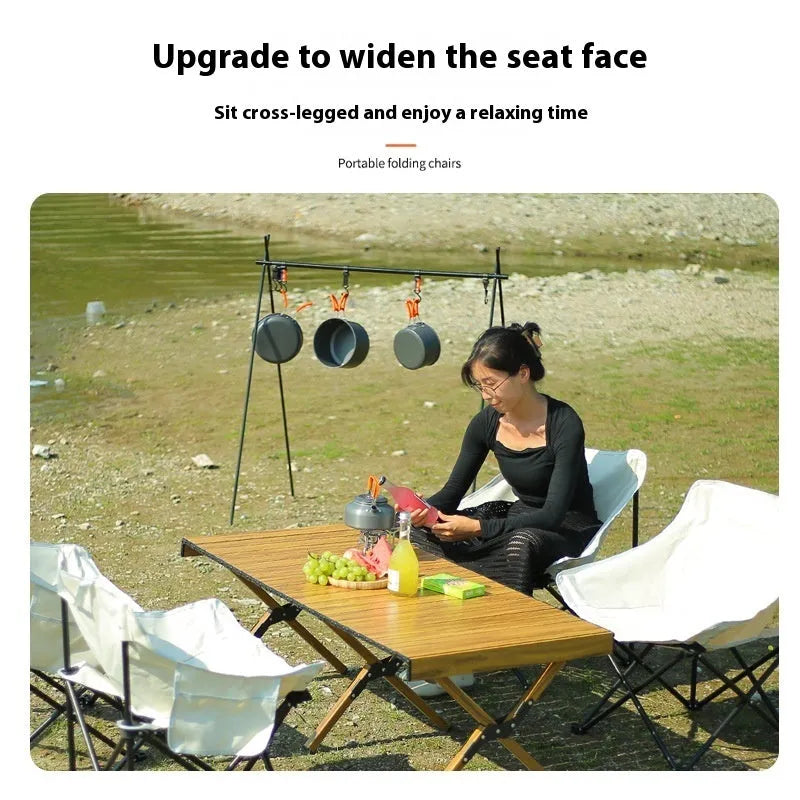 Beige folding chair with Oxford cloth seat and steel frame in outdoor setting
