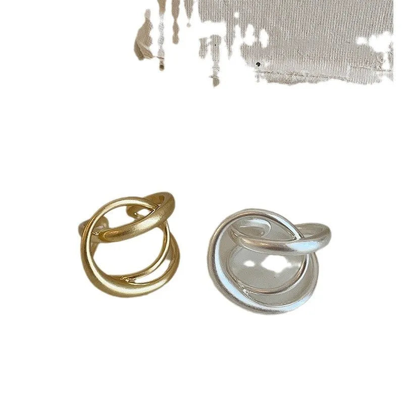 Women's matte metal open ring with three-dimensional interlaced geometric design in gold or silver finish