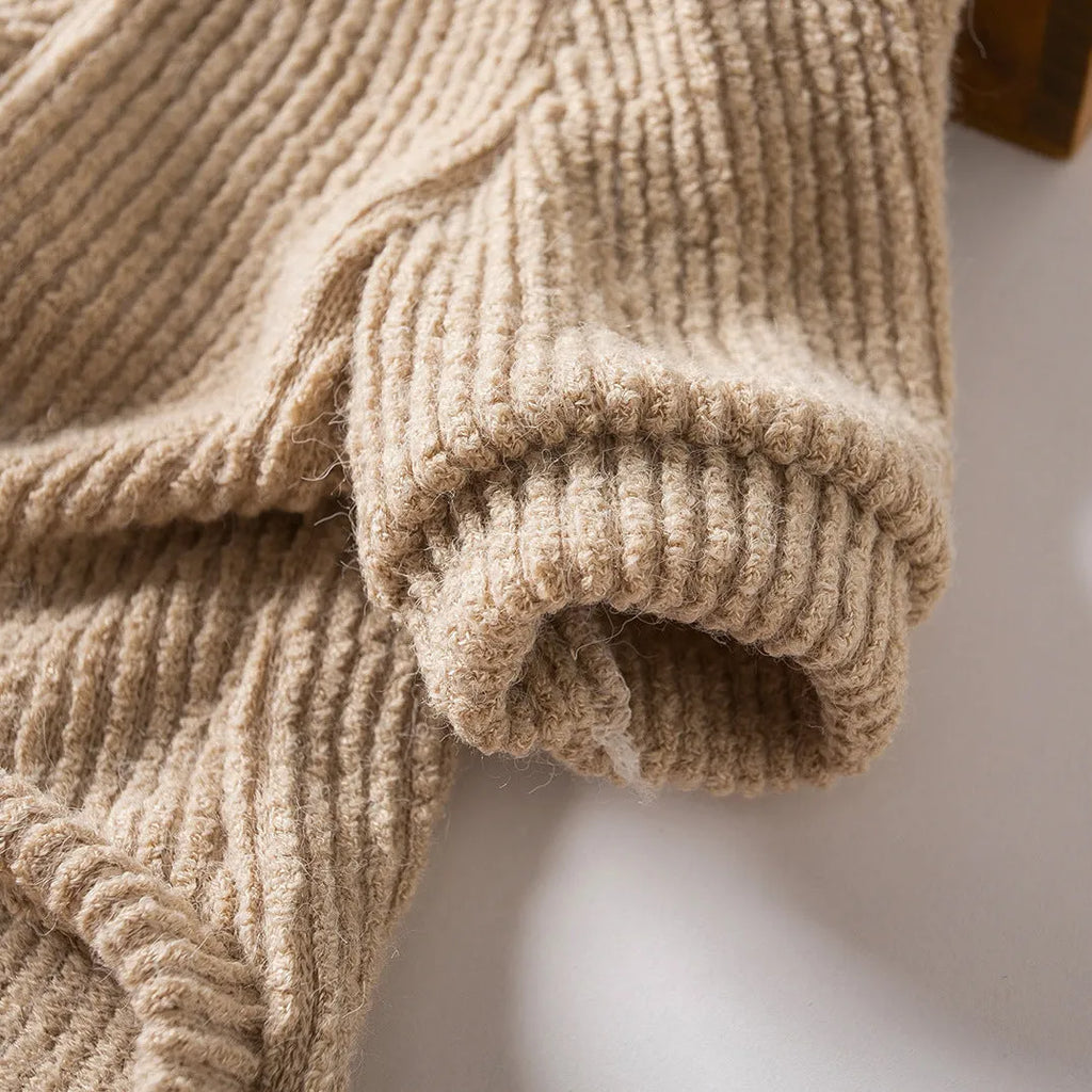 Brown cloth dog sweater pullover on a small white dog, showing casual style.