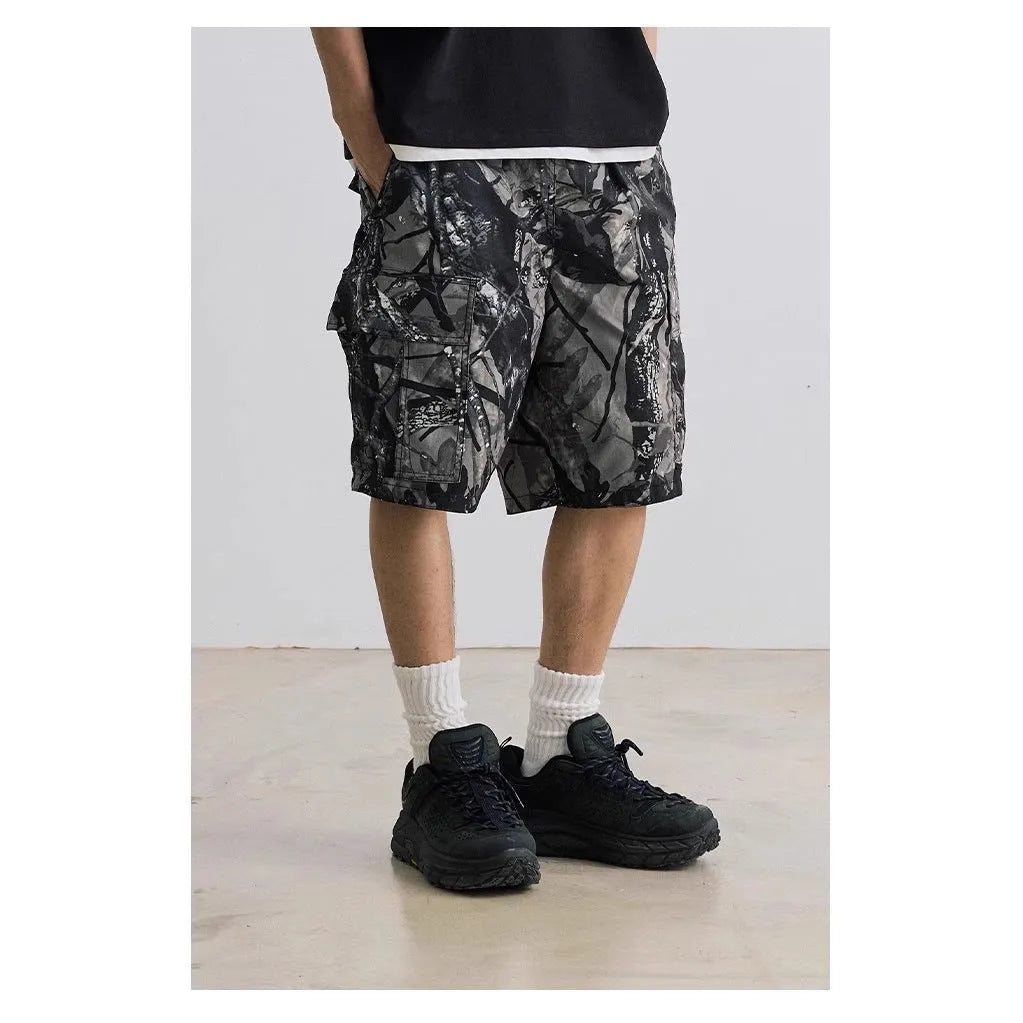 Loose fit straight-leg denim shorts in black shown on a hanger.