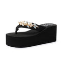 Women's black wedge-heel flip-flops with cotton cloth upper and toe strap