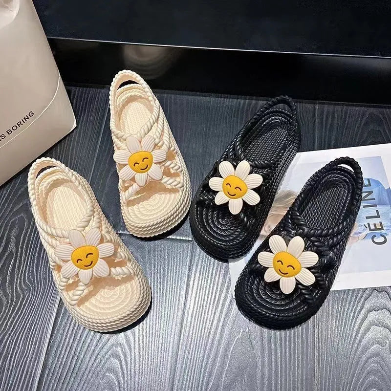PVC round-toe sandals with non-slip soles and floral decoration in beige and black colour options