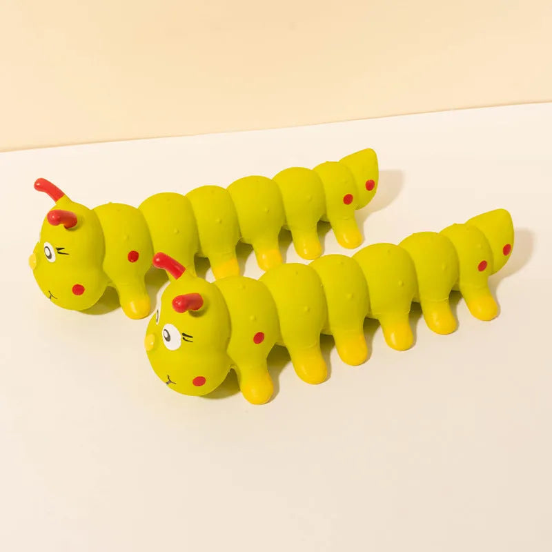 Yellow caterpillar-shaped rubber dog toy with squeaker measuring 25.5 cm
