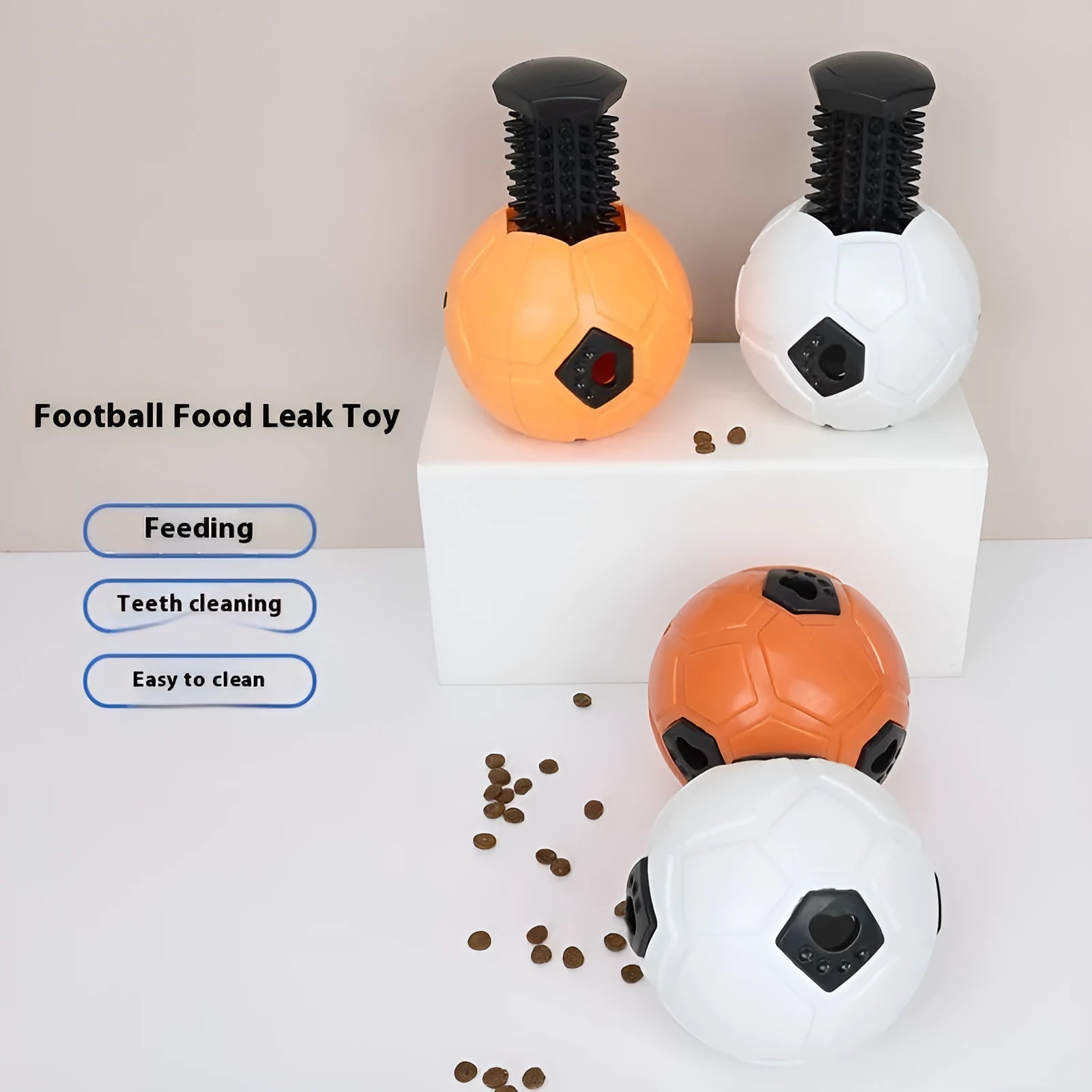 Orange and white TPR dog toy balls for chewing, one hollow and one with a teeth cleaning stick.